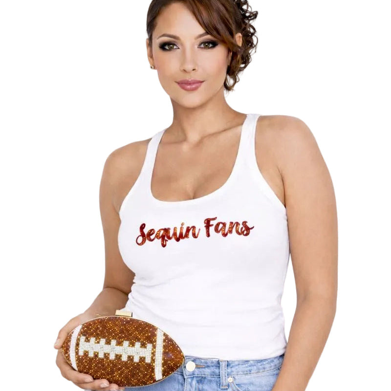 Model wearing a brown crystal football clutch on a chain shoulder strap
